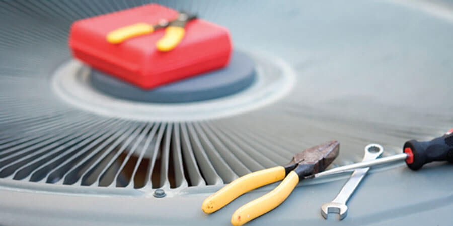 Tools on top of an AC unit