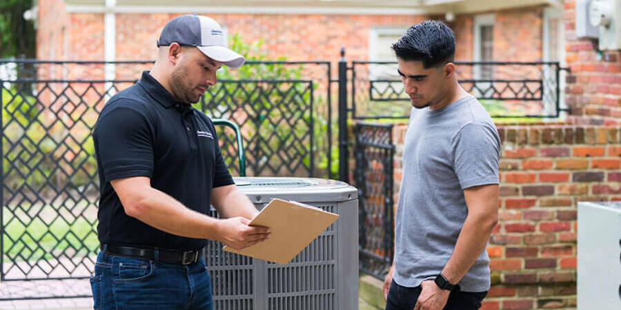 Tech talking to customer